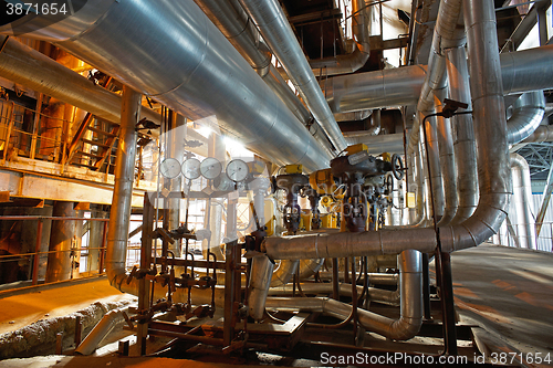 Image of Equipment, cables and piping as found inside of a modern industr