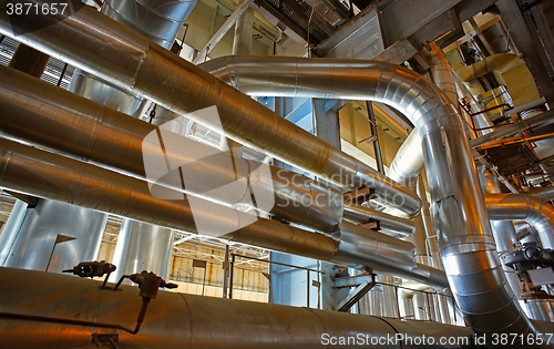 Image of Equipment, cables and piping as found inside of a modern industr