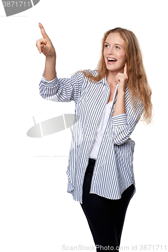 Image of Happy excited woman pointing to the side