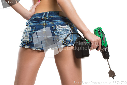 Image of girl holding a drill near the booty