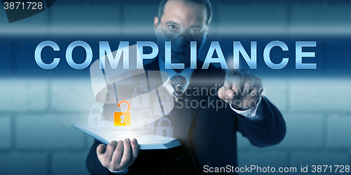 Image of Businessman Touching COMPLIANCE