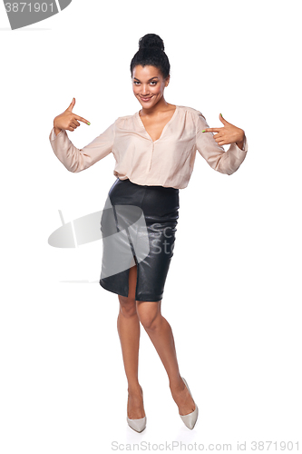 Image of Business woman in full length pointing at herself