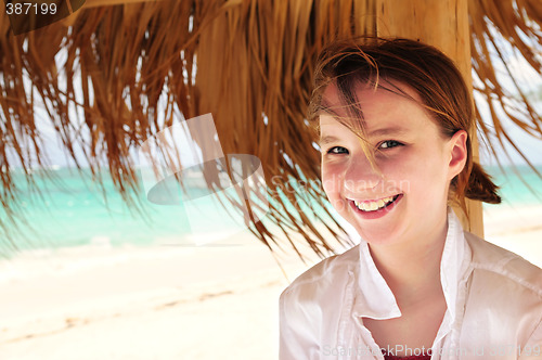 Image of Young girl on tropical beach