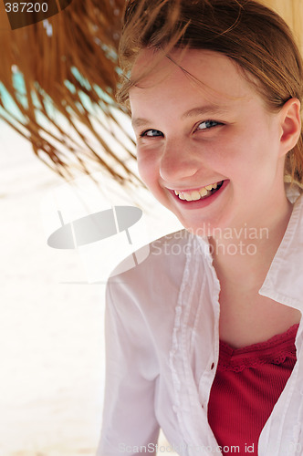 Image of Young girl on tropical beach
