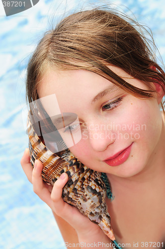 Image of Young girl with seashell