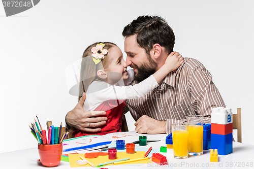 Image of The daughter and father drawing together