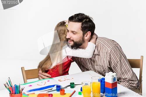 Image of The daughter and father drawing together