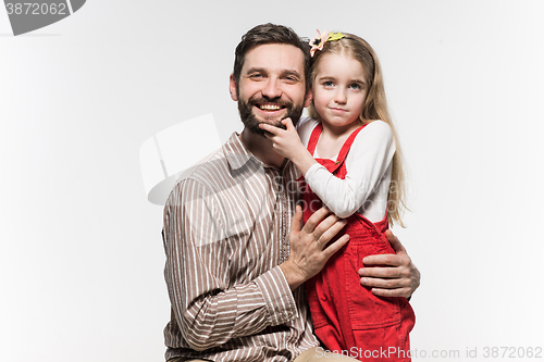 Image of Girl hugging her father  over a white background