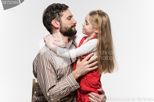 Image of Girl hugging her father  over a white background