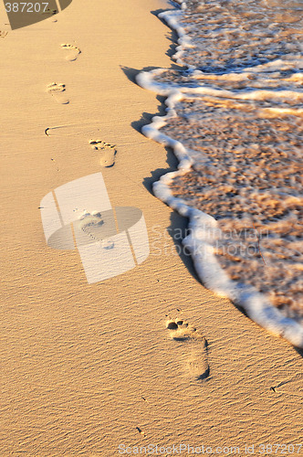 Image of Tropical beach with footprints