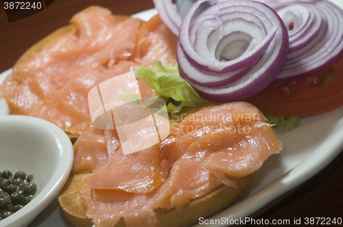 Image of bagel breakfast  smoked salmon capers red onions 