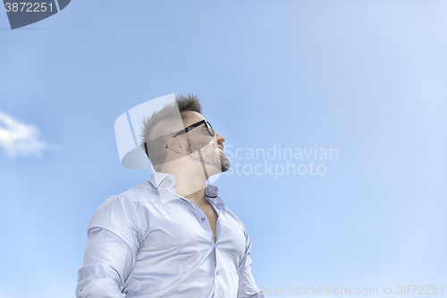 Image of bearded man blue sky