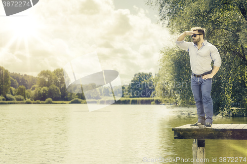 Image of watching man at the lake