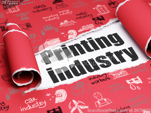 Image of Manufacuring concept: black text Printing Industry under the piece of  torn paper