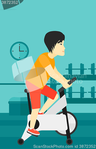 Image of Man doing cycling exercise.