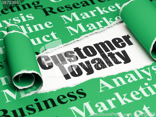 Image of Advertising concept: black text Customer Loyalty under the piece of  torn paper