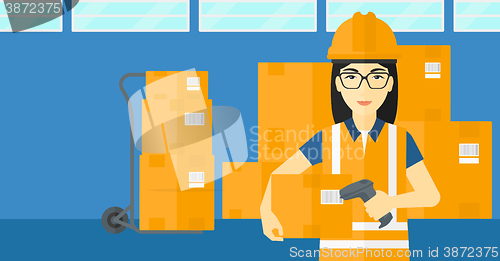 Image of Worker checking barcode on box.