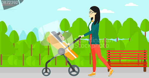 Image of Woman pushing pram.