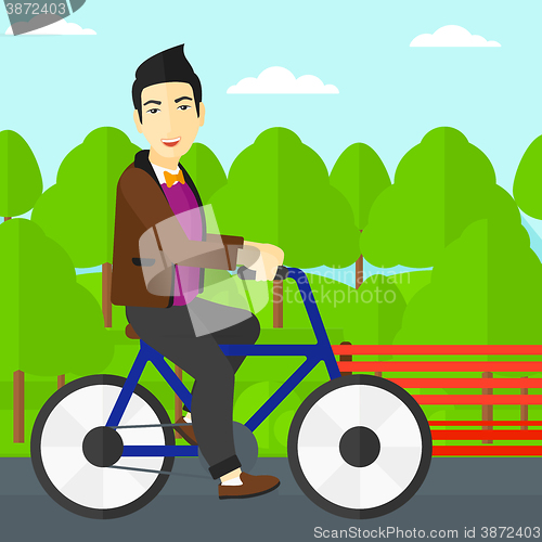 Image of Man riding bicycle.