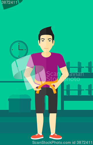Image of Man measuring waist.