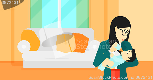 Image of Woman feeding baby.