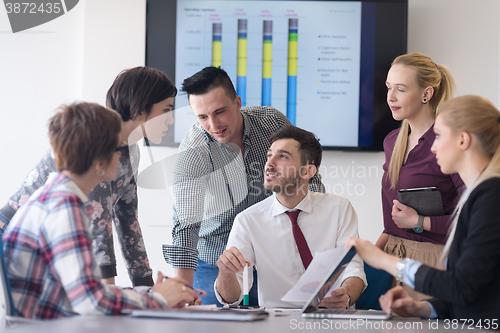 Image of young business people group on meeting at modern office