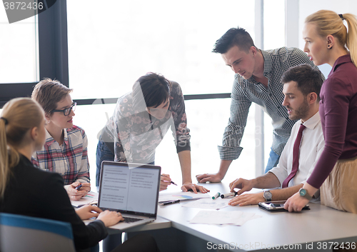 Image of young business people group on meeting at modern office