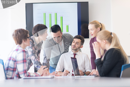 Image of young business people group on meeting at modern office