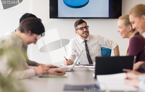 Image of young business people group on team meeting at modern office