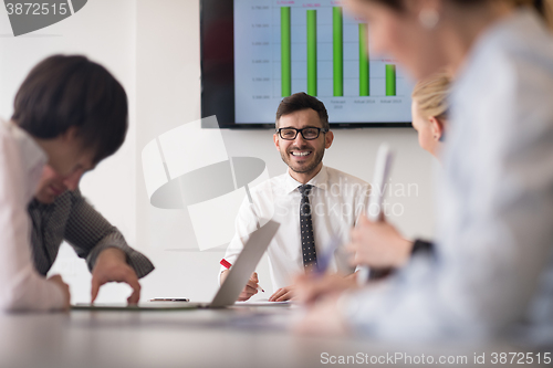 Image of young business people group on team meeting at modern office