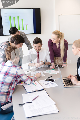 Image of young business people group on meeting at modern office