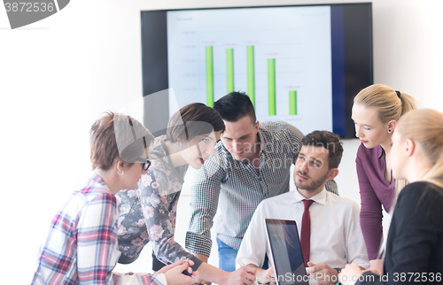 Image of young business people group on meeting at modern office