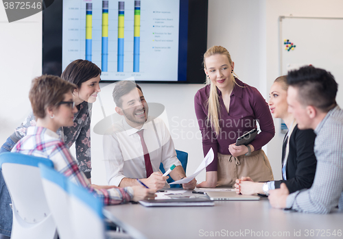 Image of young business people group on meeting at modern office