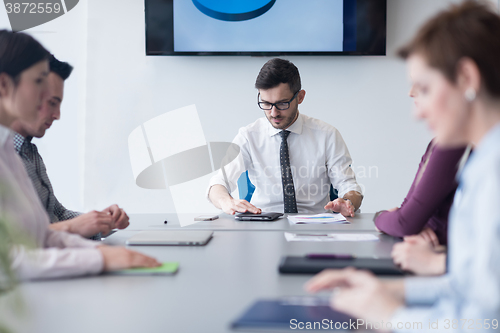 Image of young business people group on team meeting at modern office