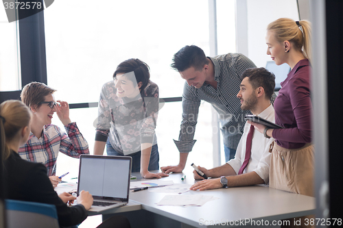 Image of young business people group on meeting at modern office