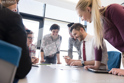 Image of young business people group on meeting at modern office