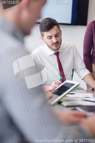 Image of young business people group on meeting at modern office