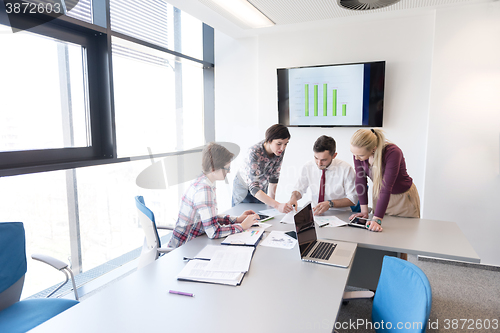 Image of young business people group on meeting at modern office