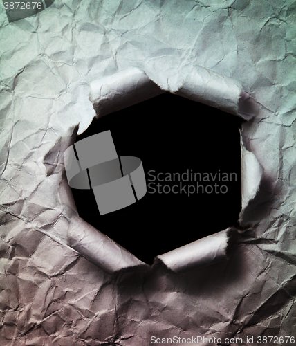 Image of Crumpled Paper Background with Big Black Hole Punched Through
