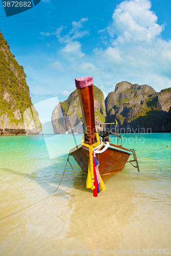 Image of Traditional Longtail Boat Tied to a Tropical Beach in Thailand