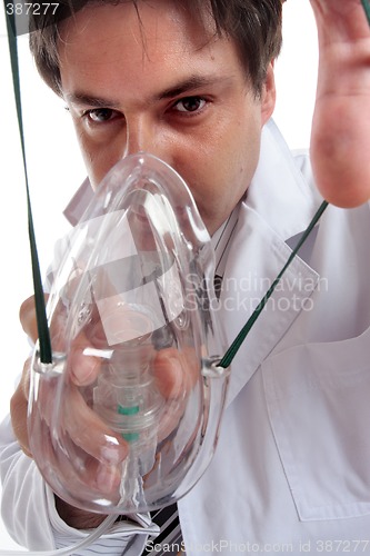 Image of Doctor putting on oxygen mask