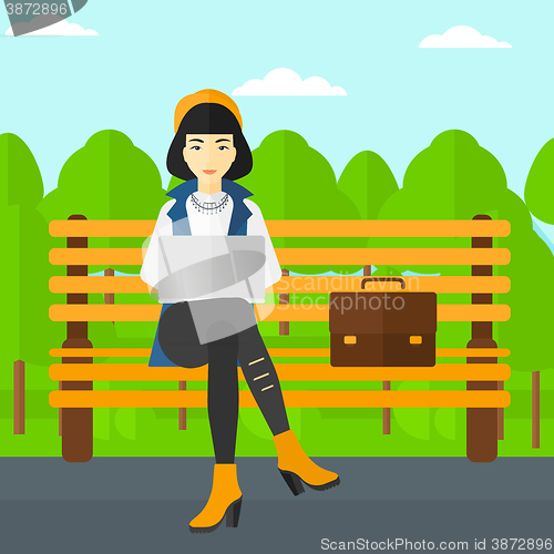 Image of Woman working on laptop.