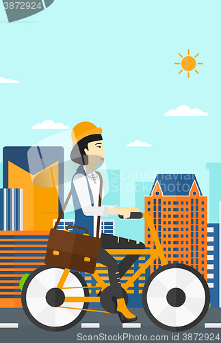 Image of Woman cycling to work.