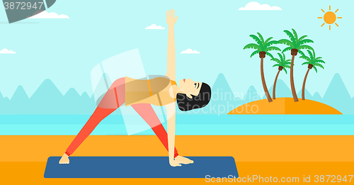 Image of Woman practicing yoga.