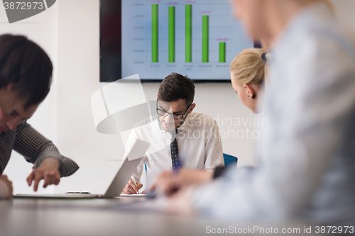 Image of young business people group on team meeting at modern office