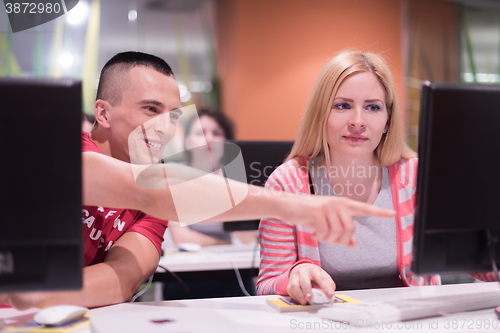 Image of technology students group working  in computer lab school  class