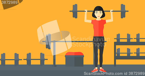 Image of Woman lifting barbell.