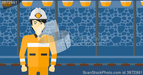 Image of Confident miner in hardhat.