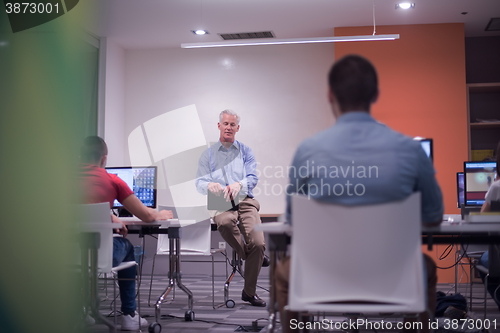 Image of teacher and students in computer lab classroom