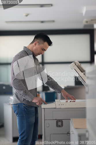 Image of young  business man copy documents